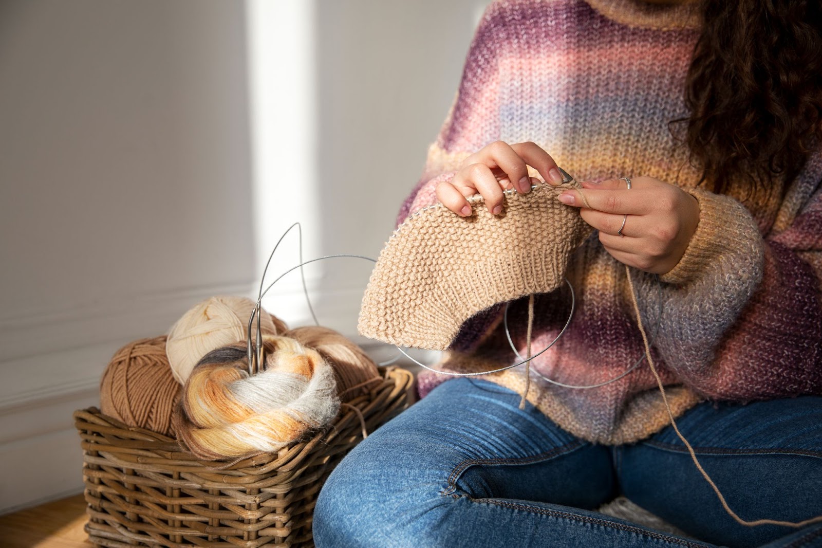 woman knitting on floor